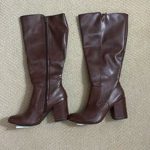 Never worn before knee high boots.